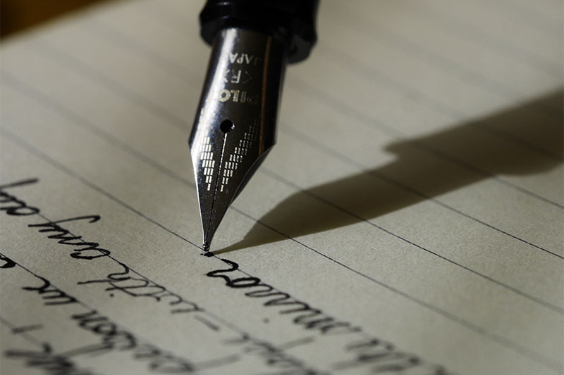 Close up of a fountain pen while writing